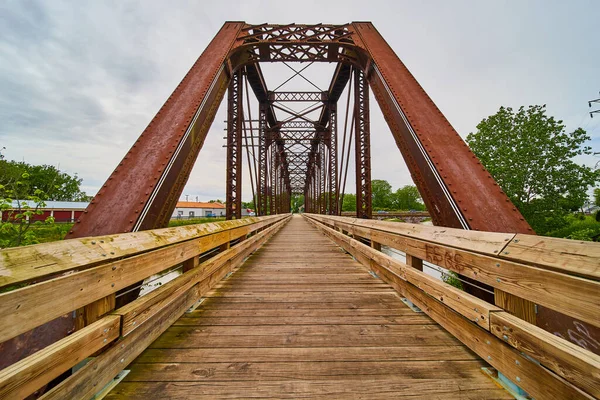 Image of Wooden walking bridge inside converted old railway train bridge in Mount Vernon Ohio