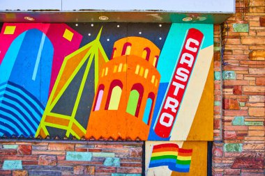 San Francisco binaları ve gökkuşağı bayrağının üstünde Castro olan duvar resmi