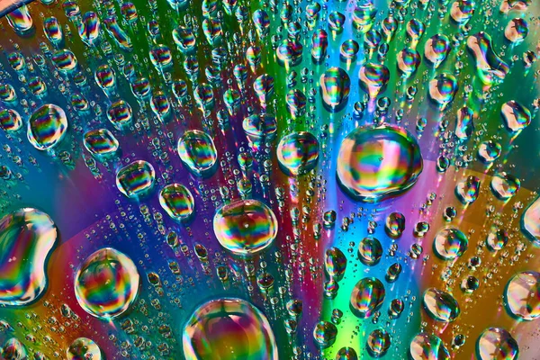 Image of Upward flowing fizzy rainbow bubbles bursting with colors in abstract background asset
