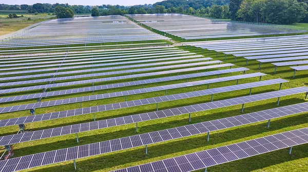 Image of Solar farm with rows or horizontal solar panels in Midwest aerial