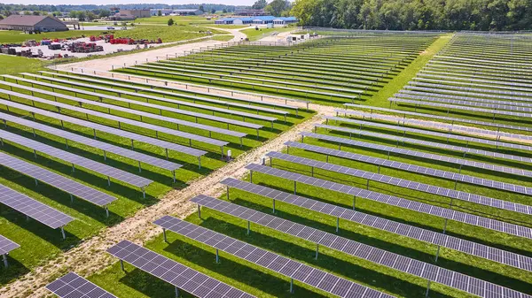 Image of Summer day in Midwest with solar farm collecting renewable energy aerial