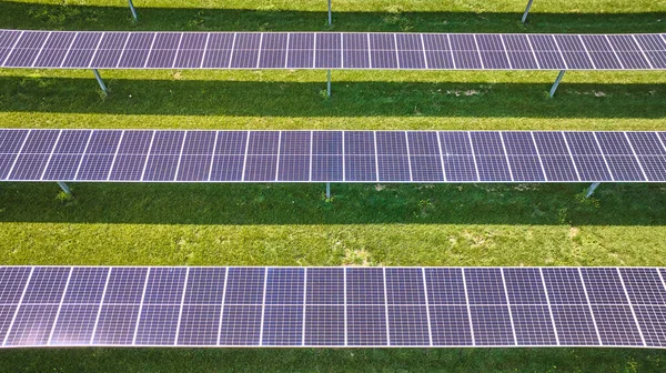 Image of Three rows of solar panels in nearly straight down aerial
