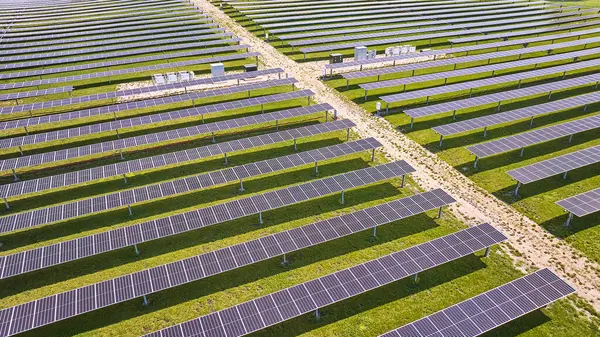 Image of Sun hitting solar panels on farm in Midwest aerial