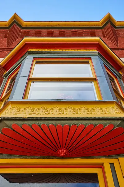 Colorful Victorian architecture details on a historic building in downtown Muncie, Indiana, 2023, under a bright sunny sky