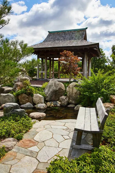 Serene Japanese-style garden with a traditional gazebo, lush greenery, and a reflective pond in 2023 Botanic Gardens, Elkhart, Indiana