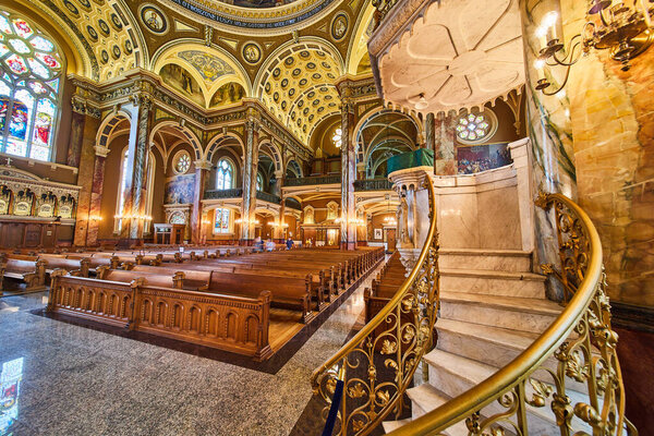 Majestic Interior of Basilica of St Josaphat, Showcasing Ornate Artwork, Sunlit Stained Glass Windows and Wooden Pews, Milwaukee, 2023