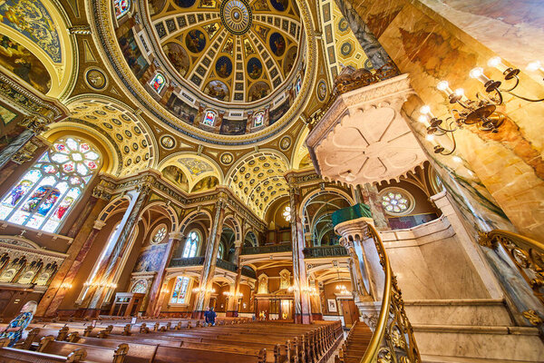 Majestic Interior of the Basilica of St Josaphat in Milwaukee, Showcasing Rich Ornate Ceiling and Stained Glass Windows, Symbolizing Christian Heritage and Spirituality.