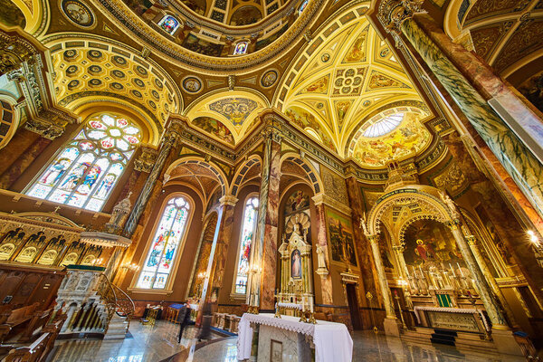 Breathtaking Interior View of St. Josaphats Basilica, Showcasing Stained Glass, Ornate Ceiling and Golden Altar