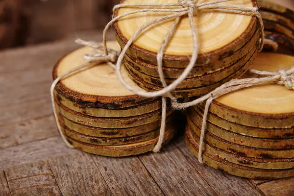 Rustic handcrafted wood slices tied with twine, showcasing natural textures and sustainability, Fort Wayne, Indiana, 2015