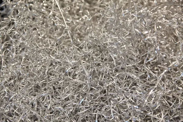 Işıldayan metal talaşları, Fort Wayne, Indiana 'daki endüstriyel süreçlerin büyüleyici yan ürünlerini gözler önüne sererek bu yakın perspektifte karmaşık desenler oluşturur..