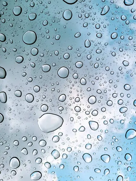 2022, Dense Water Droplets on Glass against Soft-Focus Sky, Columbus, Ohio - Symbolizing Purity and Freshness