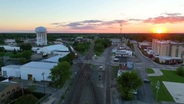 Aerial Tilt Shot Muncie Indiana Golden Hour Freight Train Glides — Stock Video