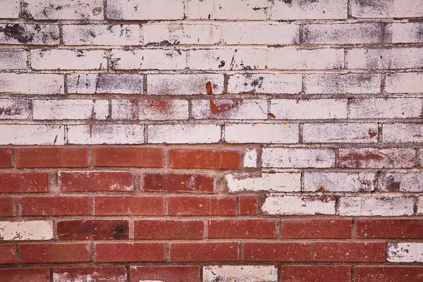 Close-up of contrasting white and red aged bricks, revealing resilience and history, at Fort Waynes Electric Works in Indiana.