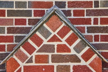 Geometric brickwork with metallic trim in South Wayne Historic District, showcasing craftsmanship and stability. clipart