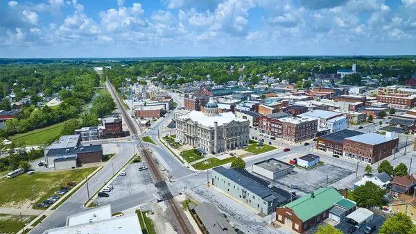 stock image Aerial view of Huntington, Indiana showcasing the historic Huntington County Superior Court courthouse, surrounded by quaint buildings and green spaces. A quiet day in a charming small-town setting.