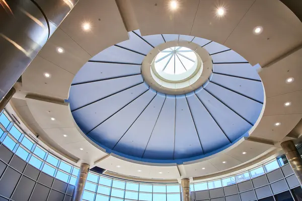 stock image Modern design and natural light pour into the Minneapolis airport through a striking circular skylight, framed by blue panels. The sleek architecture and open space create a serene and innovative