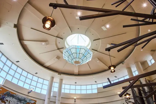 stock image Stunning interior of Minneapolis airports modern lobby featuring a spacious circular design with a striking skylight, geometric light fixture, and abundant natural light. Ideal for architecture and