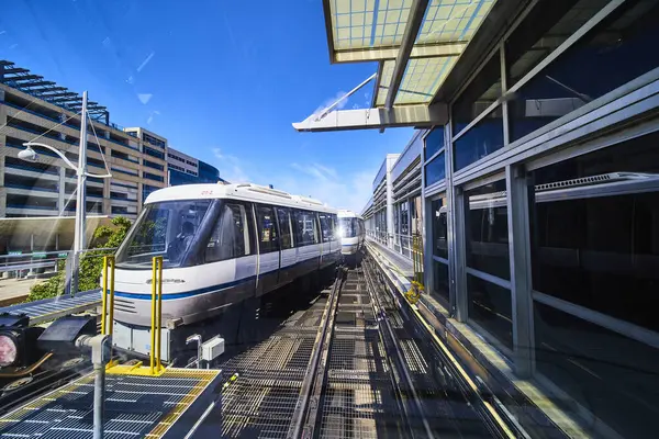 stock image Modern trams in a sleek, sunlit station in Minneapolis, Minnesota, symbolize urban connectivity and sustainable transportation. Perfect for concepts of progress, city life, and clean energy transit