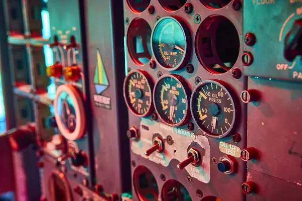 Stock image Vintage control panel inside the Airplane House in Portland, Oregon. Analog gauges and dials softly lit, evoke themes of history, engineering, and reliability in a maritime or industrial setting.