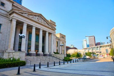 Experience the grandeur of Nashville Schermerhorn Symphony Center, where neoclassical elegance meets modern skyline beauty. A perfect blend of culture and urban sophistication under clear blue skies. clipart