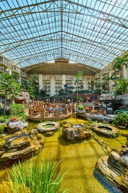 Experience relaxation and luxury in the heart of Nashville at Gaylord Opryland. Enjoy dining in a lush indoor garden with natural light streaming through the glass ceiling. Perfect for your next