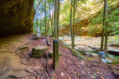 Explore the enchanting Old Mans Cave Trail in Hocking Hills Ohio. Admire the natural beauty but heed the No Trail signs and stay safe amidst the lush forest and stunning rock formations. clipart