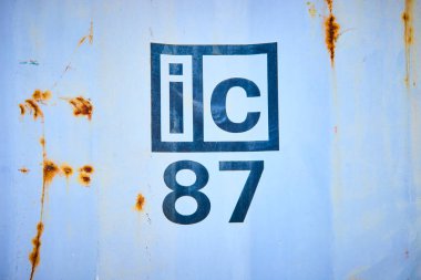 Bold ic 87 text on a weathered metal surface with rust marks, capturing industrial vintage vibes at Mount Charleston Nevada. Perfect for themes of history durability and urban art. clipart