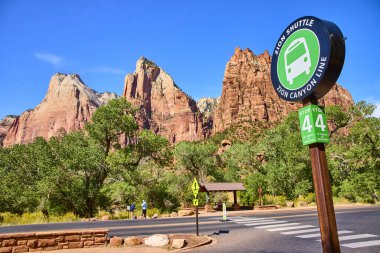 Explore Zion National Park beauty on a sunny day with shuttle convenience, stunning red rocks of the Court of the Patriarchs, and accessible trails in Springdale, Utah. Perfect for adventure seekers. clipart