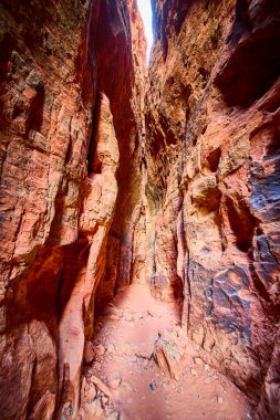 Explore the breathtaking slot canyons of Snow Canyon State Park in Ivins Utah. Marvel at the towering red rock walls and intricate geological formations under the golden desert sun. clipart