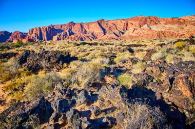 Explore the breathtaking red rock formations of Snow Canyon State Park in Utah. Bask in the golden hour glow as vibrant cliffs and diverse desert flora paint a stunning landscape of natural beauty. clipart