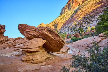 Rugged red rock formations in Zion National Park capture the golden hours glow. Discover Pine Creek Canyon stunning geological wonders and serene desert beauty in Springdale, Utah. clipart