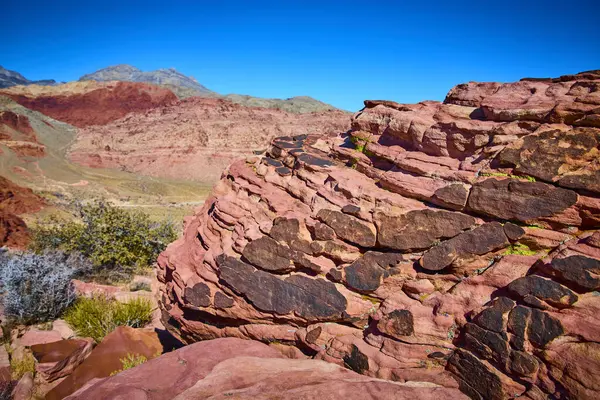 Las Vegas 'taki Grand Staircase Trail' in canlı jeolojisini araştırın. Açık mavi gökyüzüne karşı çarpıcı kızıl kaya oluşumlarına hayranlık duyun. Doğanın ebedi güzelliğinin ve macerasının bir kanıtı..