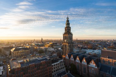 The sun setting over the historical city centre of Groningen on a beautiful afternoon. clipart