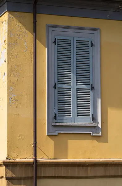 stock image Shutters in a facade of an old building in the city center of Domodossola, Italy.