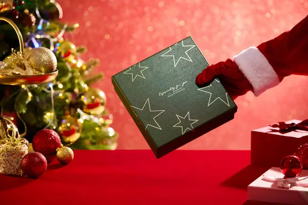 Hand Model Holding Christmas Gift Box Red Surface Featured Many — Stock Photo, Image