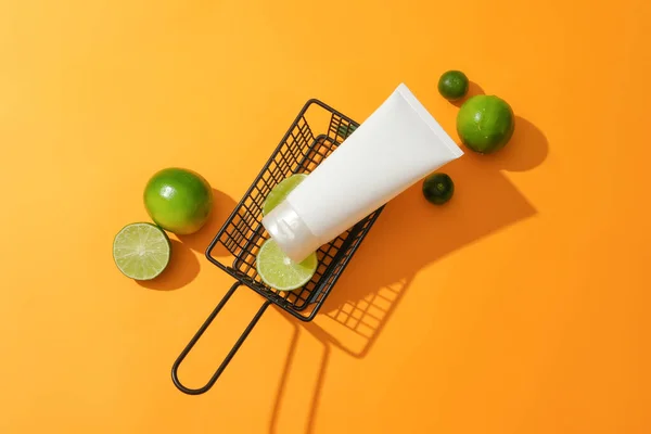 Close Unlabeled Cosmetic Tube Placed Wire Mesh Basket Fresh Lemon — Stock Photo, Image