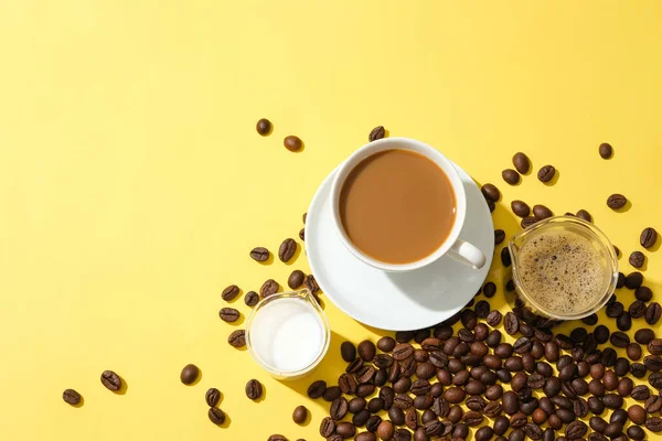 Coffee Beans Scattered Yellow Background Glass Milk Coffee Glass Black — Stock Photo, Image