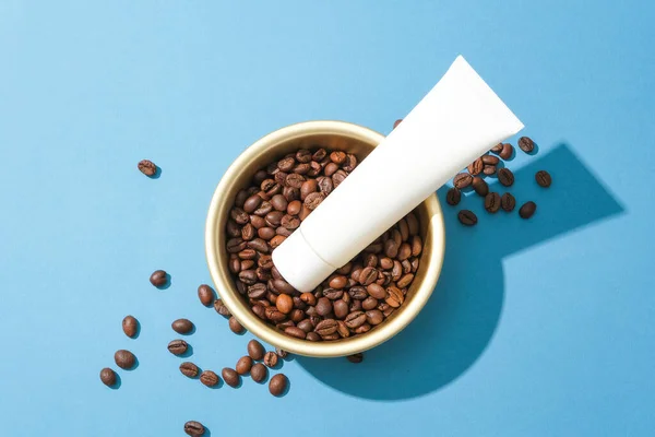 Close Cosmetic Tube Placed Top Coffee Beans Ceramic Bowl Blue — Stock Photo, Image