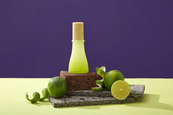 Glass Bottle Unlabeled Stone Podium Halves Lime Spiral Peel Color — Stock Photo, Image