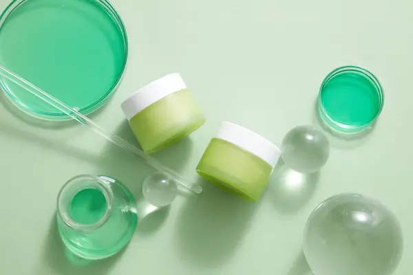 Two Unlabeled Jar Placed White Background Some Glass Balls Green — Stock Photo, Image