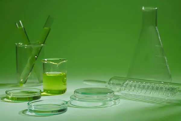 Many Laboratory Glassware Arranged Green Background Concept Scene Stage Showcase — Stock Photo, Image