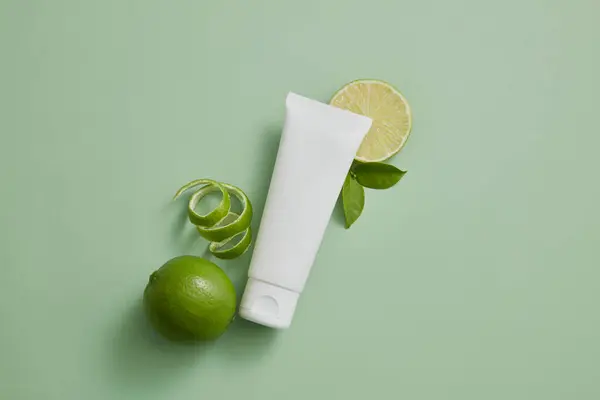 Unlabeled Tube White Color Displayed Lime Slices Peel Lime Citrus — Stock Photo, Image