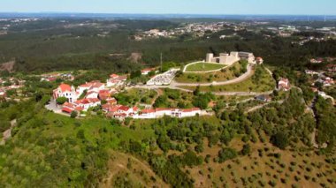 Aerial approach of panoramic cityscape of a traditional village Ourem with historic castle, Portugal