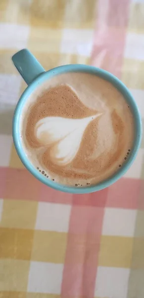 Latte Art on a colorful table cloth