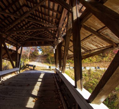 Mink Hollow Covered Bridge in Autumn, Arney Run Park, Lancaster, Ohio clipart