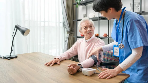 Asian Nurse Checking Elderly Man Blood Pressure Heart Rate Digital — Stock Photo, Image
