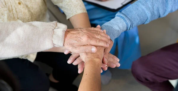 Top view of Seniors people holding  hands together in elder health  care center  , concept of old people health care , group therapy .