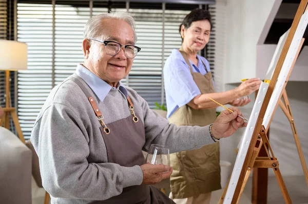 Group of Asian senior people are enjoy  painting at elderly healthcare center, elder group therapy concep