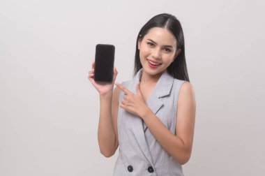 Beautiful woman using smartphone over white background, technology concept. 		