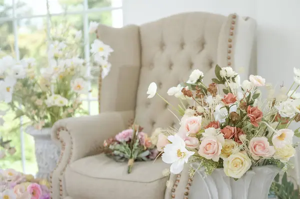 Interior of armchair decorated with Beautiful flowers for wedding ceremony.